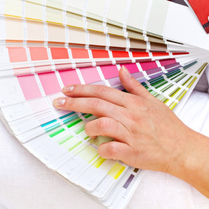 Color chart with woman hand choosing pink